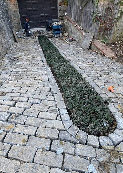 Incredible detail using antique stone for the driveway installation