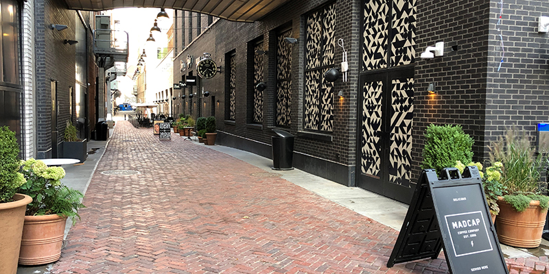The vintage Jamestown Rustic street brick pavers shine in the new retail and dining district