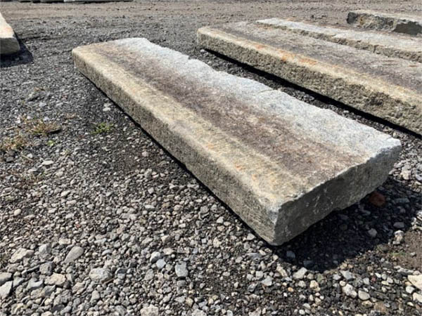 Generation 1, reclaimed granite curbing picked out in the yard.