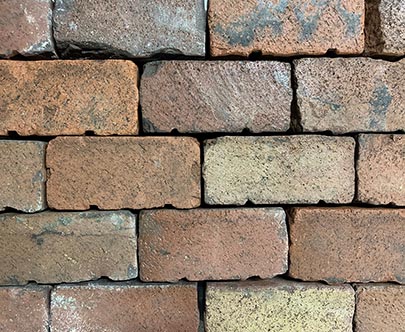 Running bond mock-up of the reclaimed Bessemer Metropolitan brick shows its color range