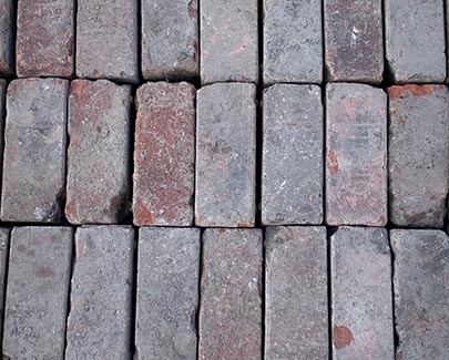 The palletized layer of our salvaged brick pavers shows the color range of rich reds, browns, and pinks