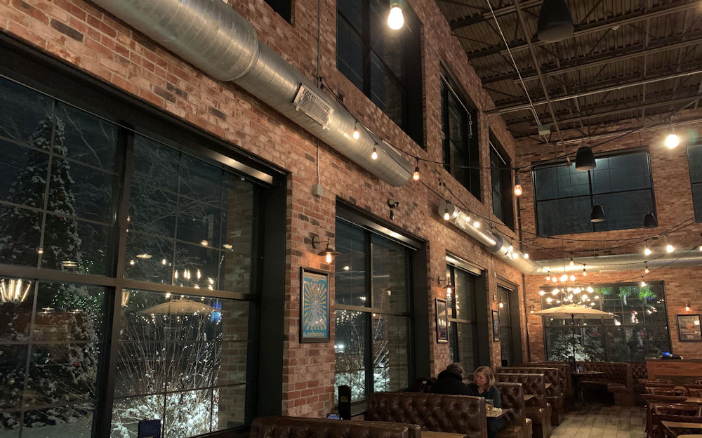 Antique thin brick wall veneer used to create a warm and inviting eating environment in restaurant