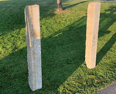 Historic, reclaimed granite curb make great 5 foot high stone posts for your next project