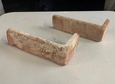Individual corner tiles, cut from antique building bricks.